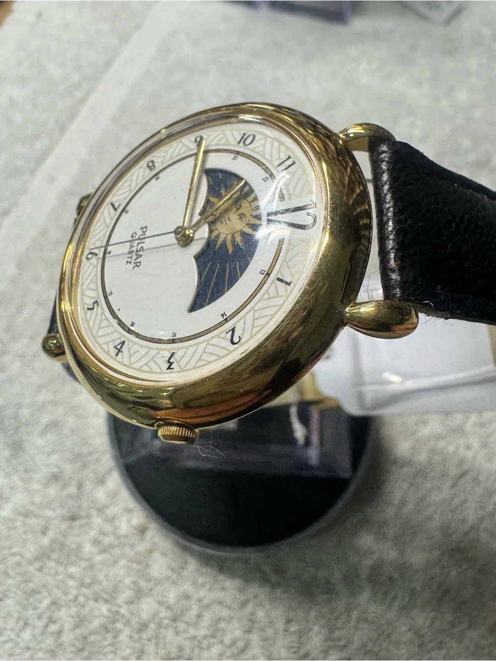 Pulsar Gold Tone Watch with White Dial and Black Strap